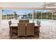 Relaxing pool area with patio furniture and canal view at 2341 W Marion Ave, Punta Gorda, FL 33950