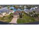 Aerial view of single-Gathering home with a lake view in a community at 24667 Rio Villa Lakes Cir, Punta Gorda, FL 33950