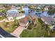 Aerial view of single-Gathering home with lake view and community at 24667 Rio Villa Lakes Cir, Punta Gorda, FL 33950