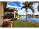 Backyard oasis with screened porch overlooking a tranquil lake at 24667 Rio Villa Lakes Cir, Punta Gorda, FL 33950