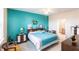 Relaxing bedroom with teal walls and a king-size bed at 24667 Rio Villa Lakes Cir, Punta Gorda, FL 33950