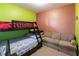 Bedroom with a bunk bed and a sofa at 24667 Rio Villa Lakes Cir, Punta Gorda, FL 33950