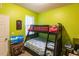 Bright bedroom with a bunk bed and a TV at 24667 Rio Villa Lakes Cir, Punta Gorda, FL 33950