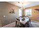 Bright dining room with a glass-top table and four chairs at 24667 Rio Villa Lakes Cir, Punta Gorda, FL 33950