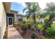 Landscaped walkway leading to the front door of the house at 24667 Rio Villa Lakes Cir, Punta Gorda, FL 33950