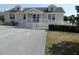 House exterior with ramp, indicating accessibility features at 24667 Rio Villa Lakes Cir, Punta Gorda, FL 33950