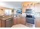 Modern kitchen with stainless steel appliances and granite countertops at 24667 Rio Villa Lakes Cir, Punta Gorda, FL 33950