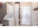 Laundry room with a stackable washer and dryer at 24667 Rio Villa Lakes Cir, Punta Gorda, FL 33950