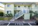 Condo building entryway with stairs and parking at 25225 Rampart Blvd # 1701, Punta Gorda, FL 33983