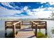 Wooden dock with seating overlooking a lake at 25225 Rampart Blvd # 1701, Punta Gorda, FL 33983