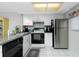 Modern kitchen featuring stainless steel appliances at 25225 Rampart Blvd # 1701, Punta Gorda, FL 33983