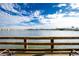 Peaceful lake view from a wooden deck at 25225 Rampart Blvd # 1701, Punta Gorda, FL 33983