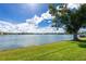 Serene lake view with lush green grass at 25225 Rampart Blvd # 1701, Punta Gorda, FL 33983