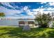 Scenic waterfront view with a wooden dock, ideal for fishing and relaxation at 25225 Rampart Blvd # 1701, Punta Gorda, FL 33983