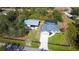 Aerial view of house with detached garage and carport at 29350 Goodhue St, Punta Gorda, FL 33982