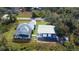 Aerial view showing house, pool, and large detached garage at 29350 Goodhue St, Punta Gorda, FL 33982