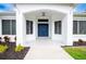 Dark blue double front doors and a covered porch at 29350 Goodhue St, Punta Gorda, FL 33982