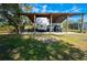 Covered RV carport with ample space for vehicles and toys at 29350 Goodhue St, Punta Gorda, FL 33982