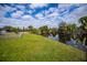 Spacious backyard with canal views and fenced area at 3448 Middletown St, Port Charlotte, FL 33952