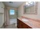 Bathroom with tub, granite vanity and mosaic tile at 3448 Middletown St, Port Charlotte, FL 33952