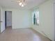 Spacious bedroom with tiled floors and ceiling fan at 3448 Middletown St, Port Charlotte, FL 33952