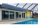 Spacious pool area with sliding glass doors leading to the outside at 3448 Middletown St, Port Charlotte, FL 33952