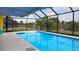 Inviting screened pool area with retractable awning, offering ample shade and privacy at 3448 Middletown St, Port Charlotte, FL 33952