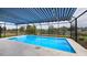 Screened pool with striped awning and canal view at 3448 Middletown St, Port Charlotte, FL 33952