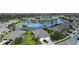 Aerial view of a neighborhood with a lake in the center at 3717 Lakewood Blvd, North Port, FL 34287