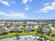 Community overview featuring houses and a lake; serene setting at 3717 Lakewood Blvd, North Port, FL 34287