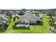 Aerial view of a house with a screened-in pool and yard at 3717 Lakewood Blvd, North Port, FL 34287