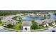 Aerial view of a lakefront community with numerous houses at 3717 Lakewood Blvd, North Port, FL 34287