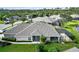 Aerial view showing a house with a screened-in pool area at 3717 Lakewood Blvd, North Port, FL 34287