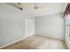 Spacious bedroom featuring a double door closet and ceiling fan at 3717 Lakewood Blvd, North Port, FL 34287