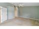 Large bedroom with ceiling fan and neutral walls, carpet flooring at 3717 Lakewood Blvd, North Port, FL 34287