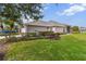 House with screened porch and manicured lawn at 3717 Lakewood Blvd, North Port, FL 34287