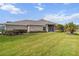 House exterior showcasing landscaping and lawn at 3717 Lakewood Blvd, North Port, FL 34287