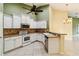 Modern kitchen featuring stainless steel appliances and white cabinets at 3717 Lakewood Blvd, North Port, FL 34287