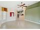 Spacious living room with tile floors and ceiling fan at 3717 Lakewood Blvd, North Port, FL 34287