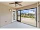 Spacious screened patio with lake view and sliding glass doors at 3717 Lakewood Blvd, North Port, FL 34287