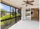 Screened patio with view of the lake and surrounding houses at 3717 Lakewood Blvd, North Port, FL 34287