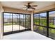 Enclosed patio with sliding glass doors and view of backyard at 3717 Lakewood Blvd, North Port, FL 34287