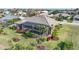 Aerial view of a house with a pool and screened enclosure at 3977 La Costa Island Ct, Punta Gorda, FL 33950