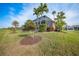 Landscaped backyard with lush tropical plants at 3977 La Costa Island Ct, Punta Gorda, FL 33950