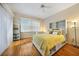 Bedroom with built-in shelving and yellow bedding at 3977 La Costa Island Ct, Punta Gorda, FL 33950