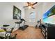 Home gym with treadmill, stationary bike, and TV at 3977 La Costa Island Ct, Punta Gorda, FL 33950