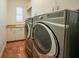 Laundry room with modern washer and dryer at 3977 La Costa Island Ct, Punta Gorda, FL 33950