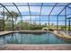 Inviting screened pool and spa with golf course views at 3977 La Costa Island Ct, Punta Gorda, FL 33950