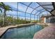 Inviting screened pool with spa and golf views at 3977 La Costa Island Ct, Punta Gorda, FL 33950