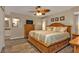 Main bedroom with wood furniture and ceiling fan at 420 Chamber Nw St, Port Charlotte, FL 33948